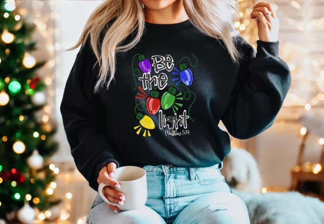 Be The Light Christmas Sweatshirt, Religious Christmas Shirt Product Photo 2