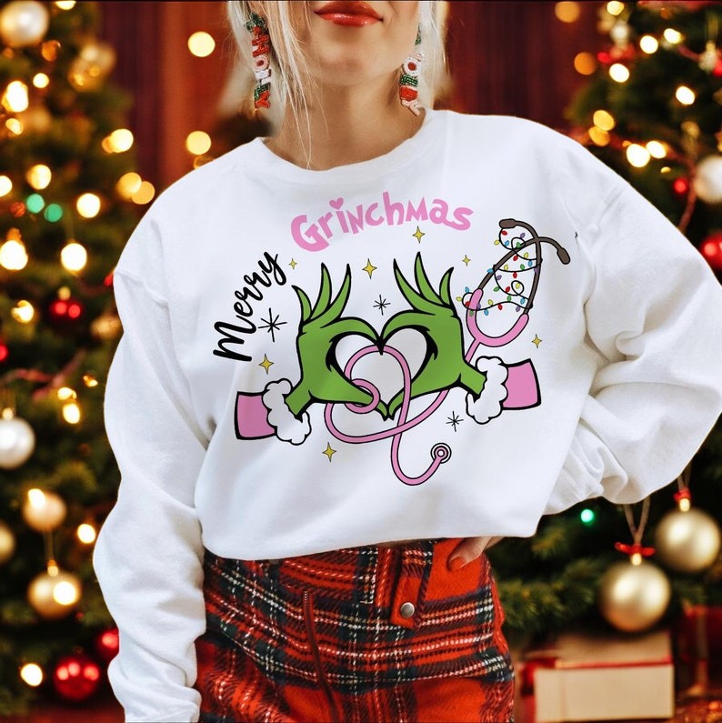 Pink Nurse Grinch Christmas Christmas Sweatshirt Product Photo 2