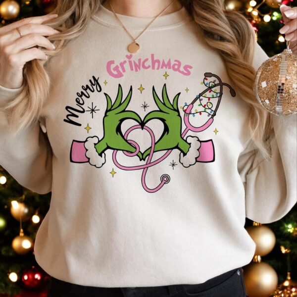 Pink Nurse Grinch Christmas Christmas Sweatshirt Product Photo 1