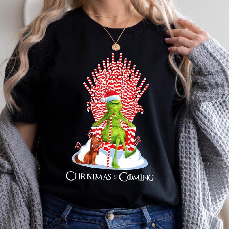 Christmas Is Coming Grinch Candy Cane Throne Funny Christmas T-Shirt Product Photo 2